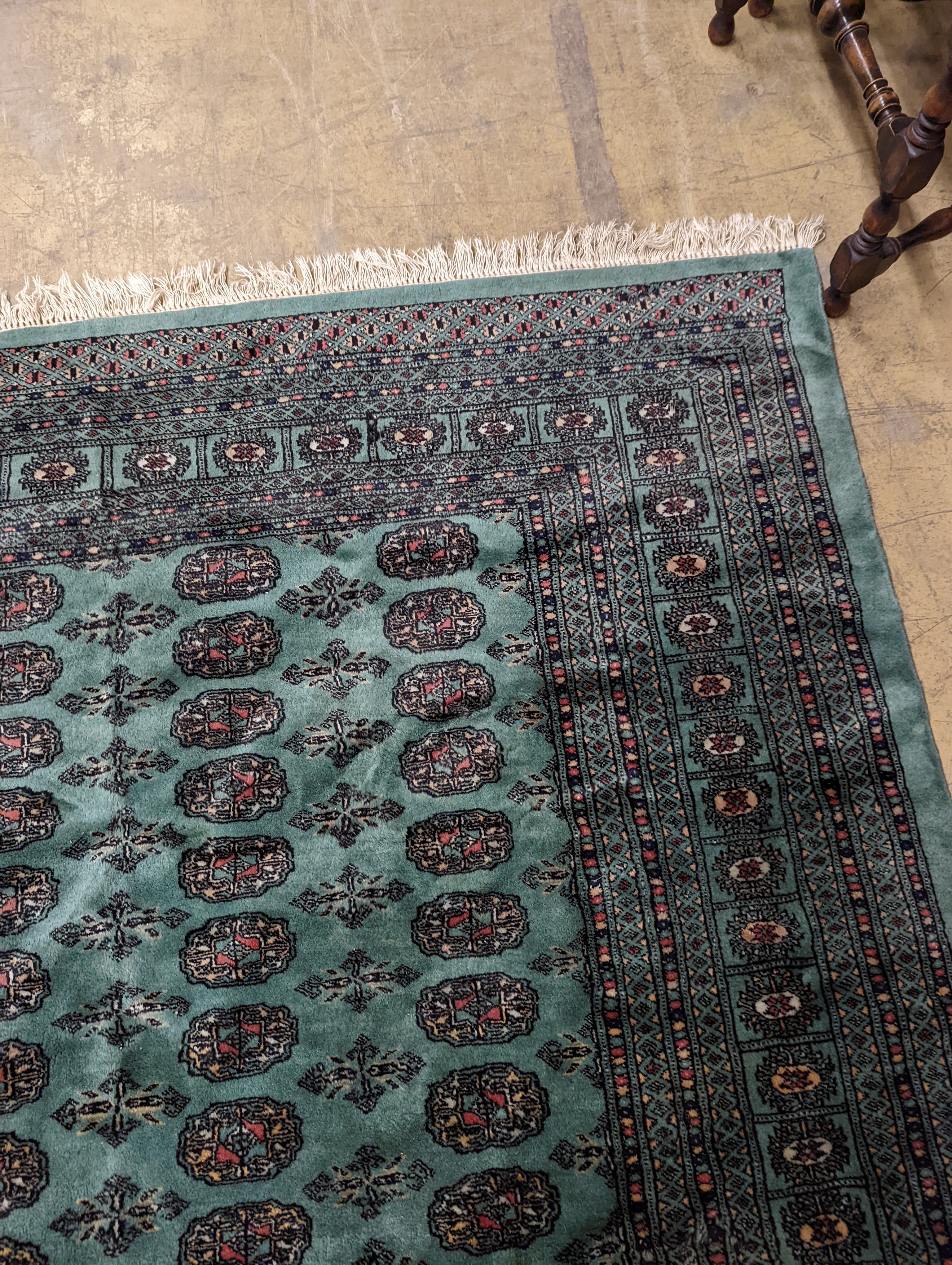 A Bokhara green ground carpet, 282 x 184cm